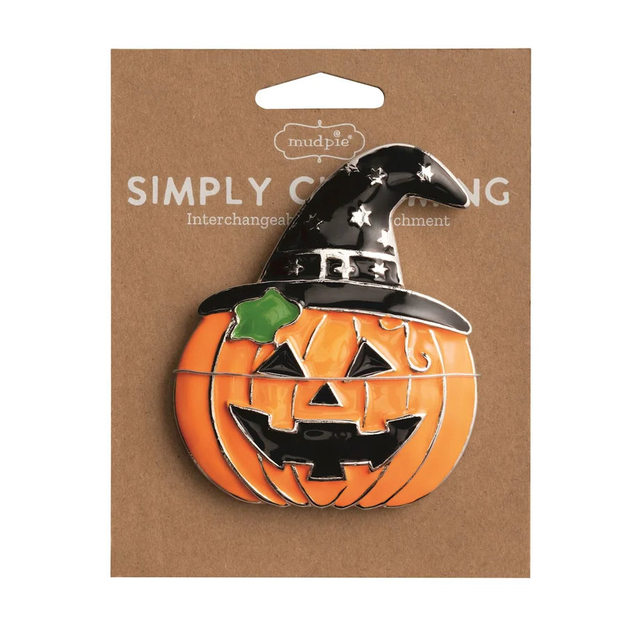 Pumpkin with witch hat on a brown card with 'Simply Charms' branding