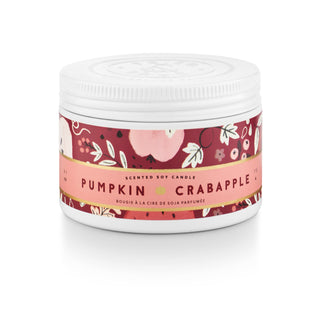 A white plastic jar of scented soy candle with a white screw-top lid and a decorative label. The label features a deep red background with illustrations of a pink pumpkin and white leaves, bordered by a gold stripe with the text 'PUMPKIN CRABAPPLE' and 'SCENTED SOY CANDLE'.