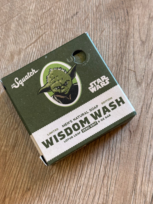 Green and white box with a logo on a wooden surface