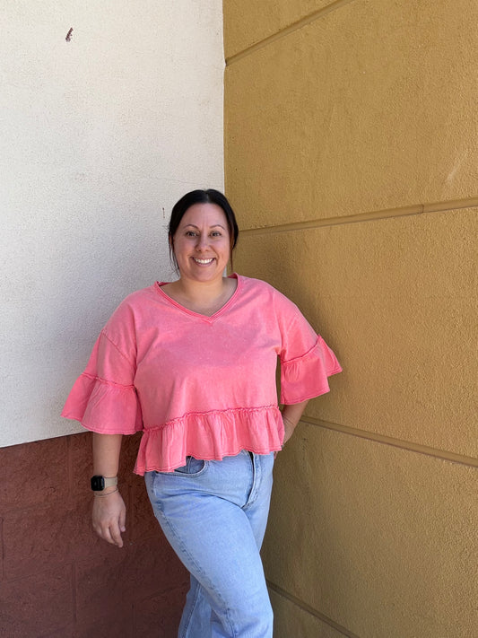 Coral ruffle knit top perfect for spring 
