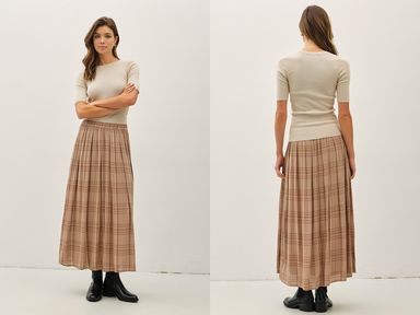 Woman wearing a beige top and plaid skirt, standing side by side with back view on a white background