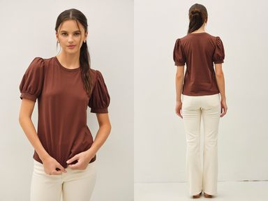 Woman wearing a choco colored puff sleeve t-shirt with white pants against a white background, shown front and back.