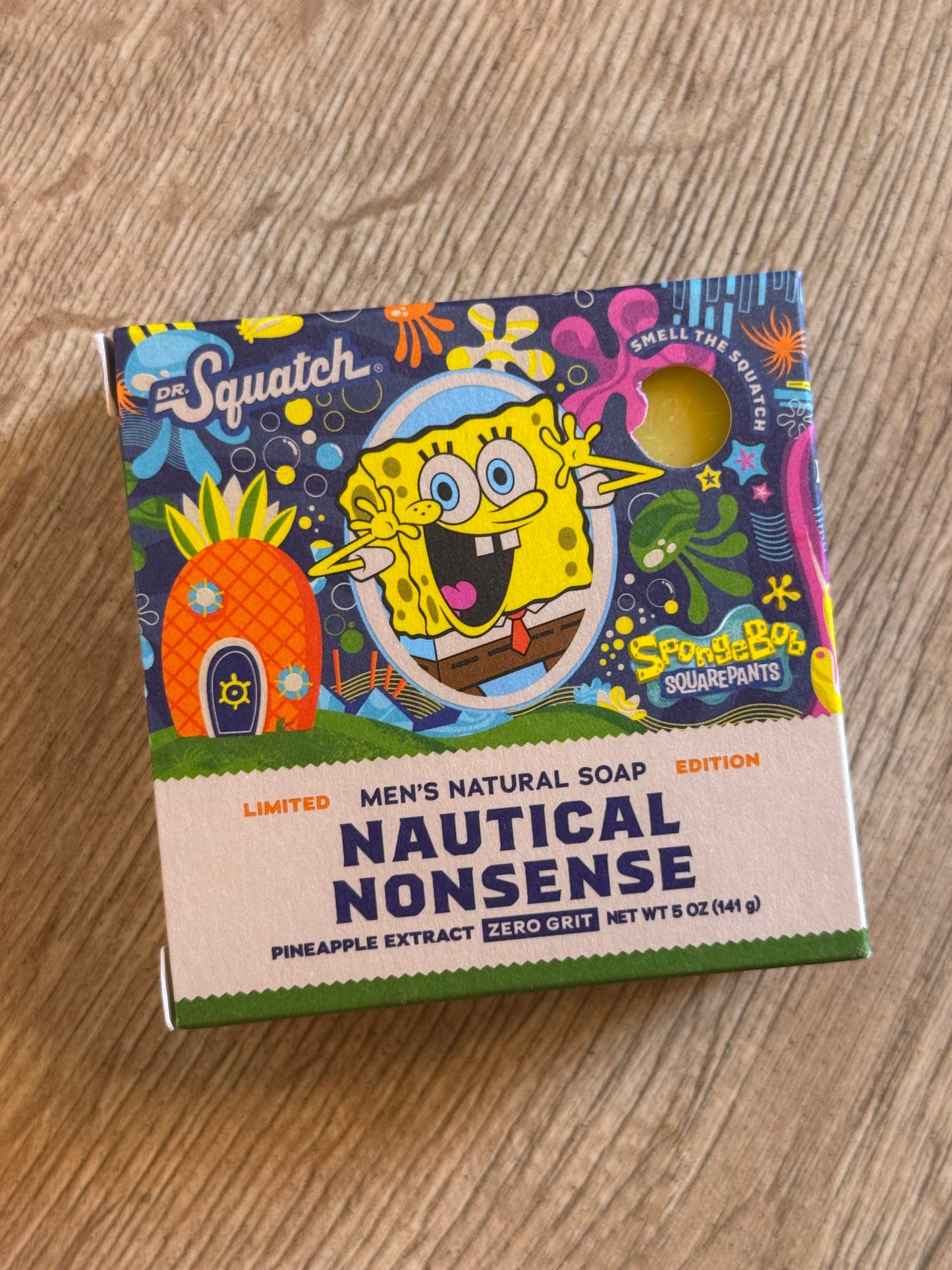 Soap packaging with SpongeBob SquarePants design on a wooden surface