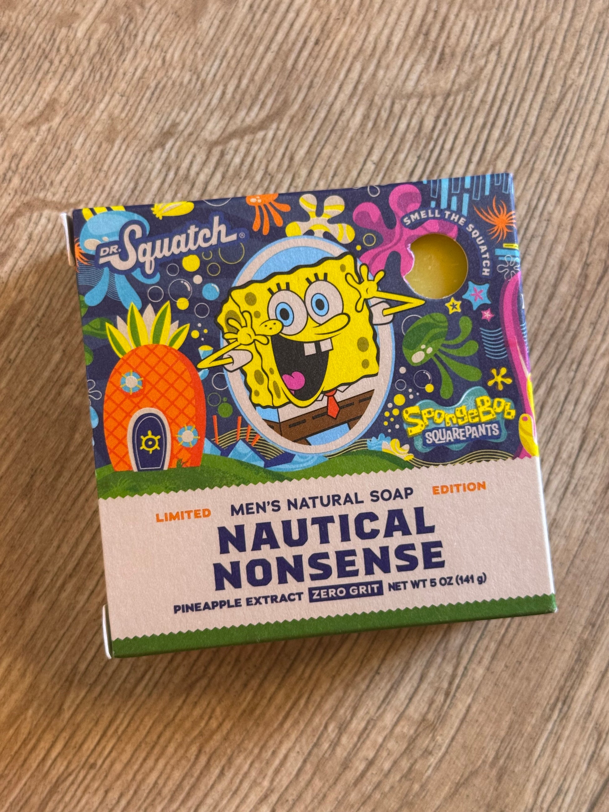 Soap packaging with SpongeBob SquarePants design on a wooden surface