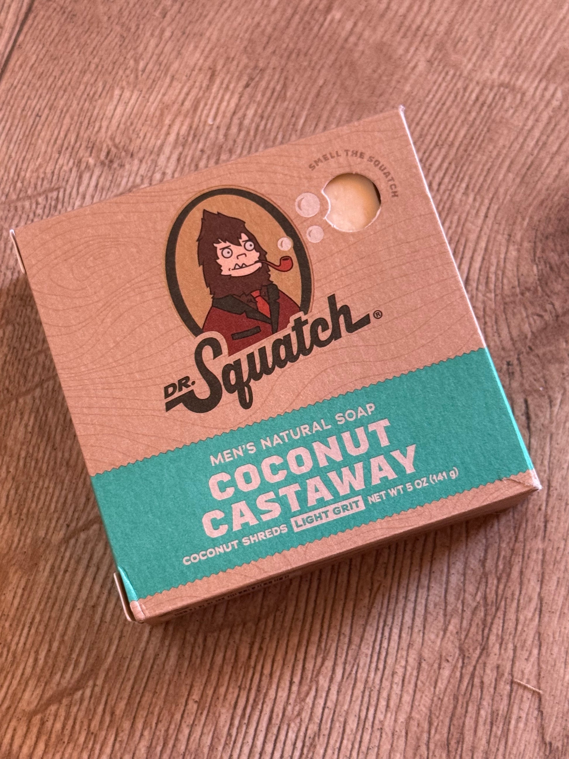 Box of dr. Squatch coconut soap on a wooden surface