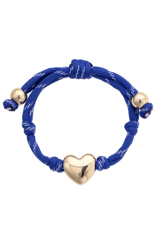 Blue bracelet with gold heart charm and beads on a white background