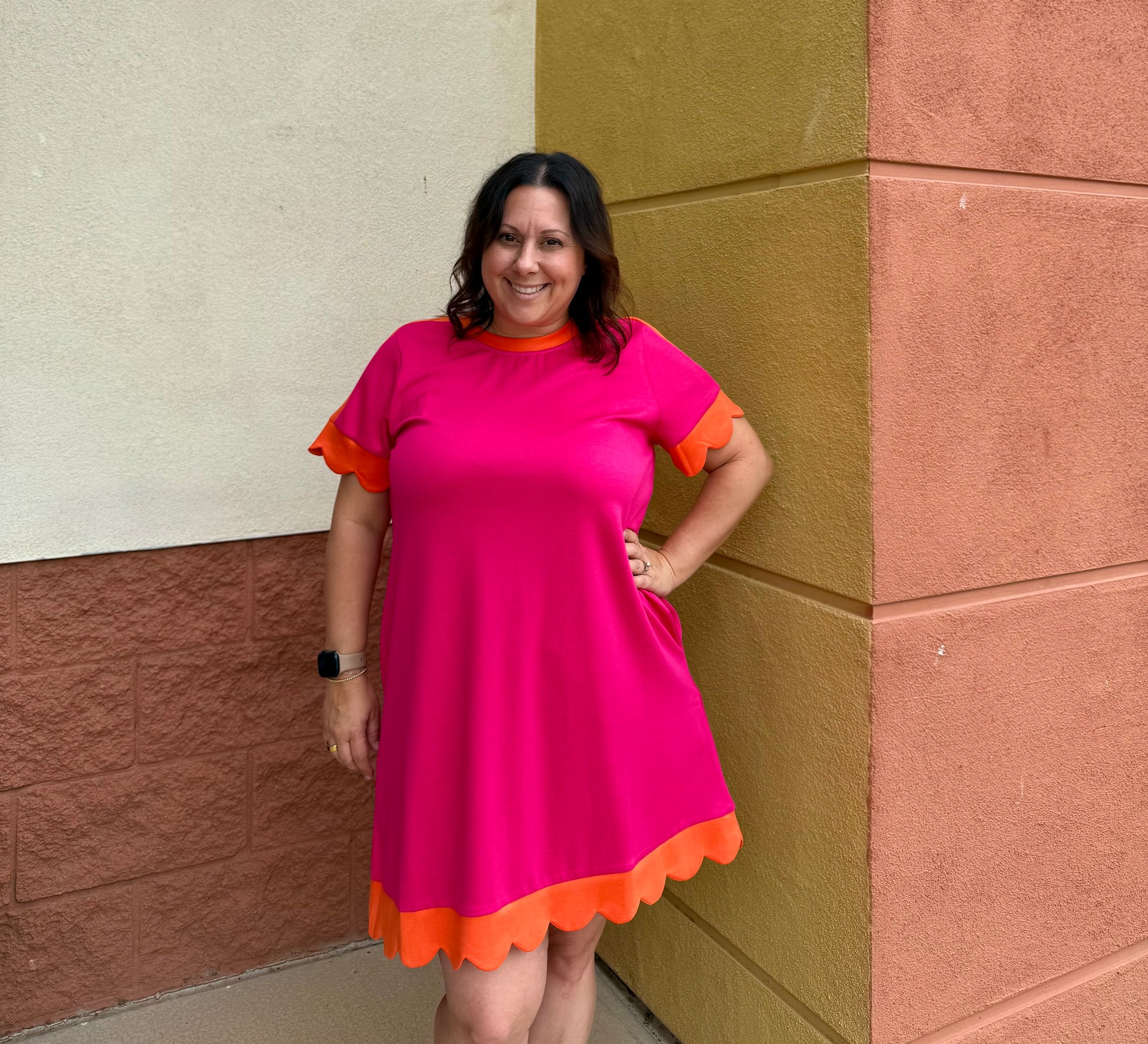 A line dress with scallops on sleeves and bottom of dress 