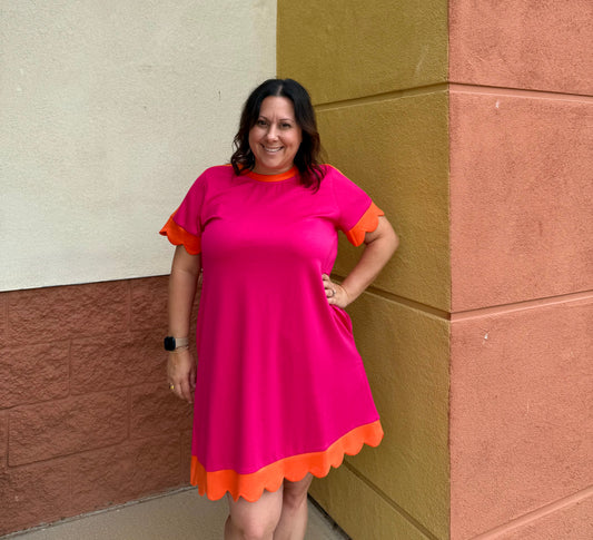 A line dress with scallops on sleeves and bottom of dress 