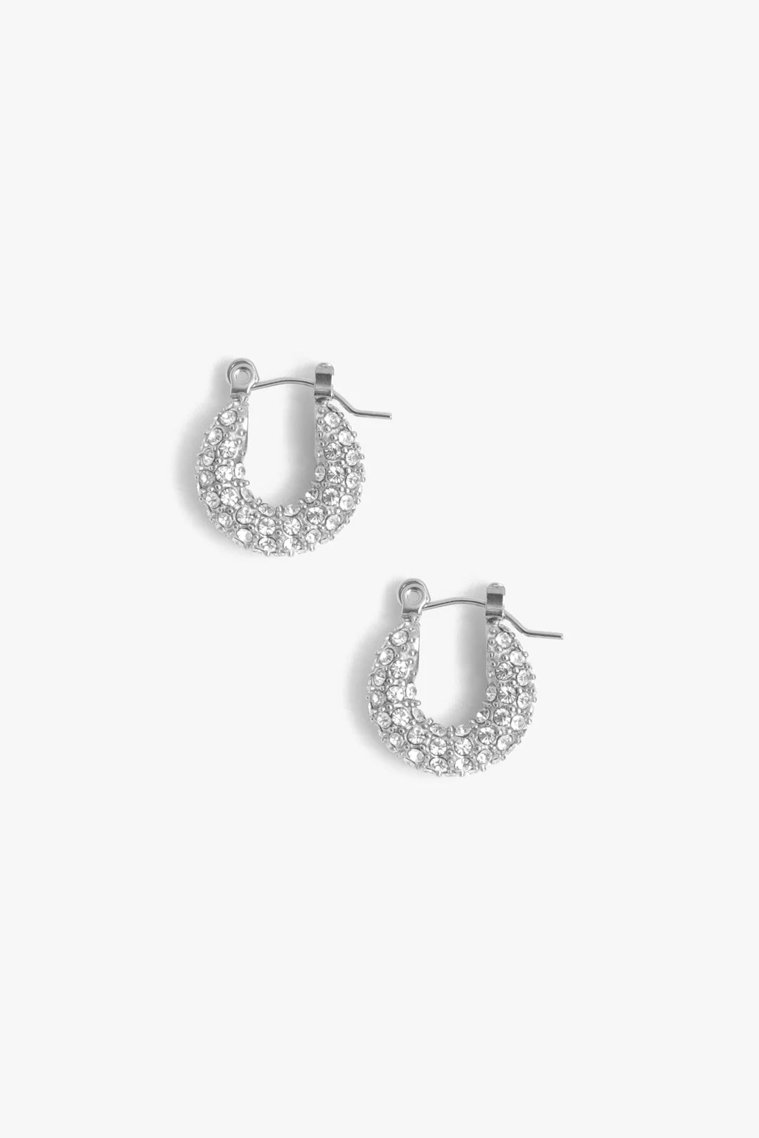 Pair of silver hoop earrings with clear gemstones on a white background