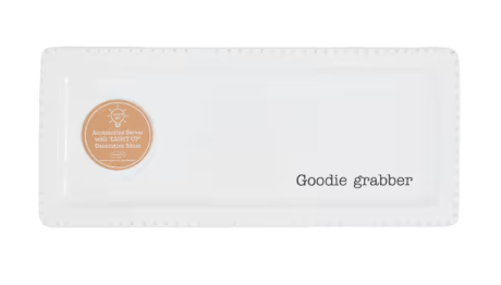A white rectangular paper tray with a serrated edge, featuring a circular gold seal on the left and the text 'Goodie grabber' printed in black on the right.